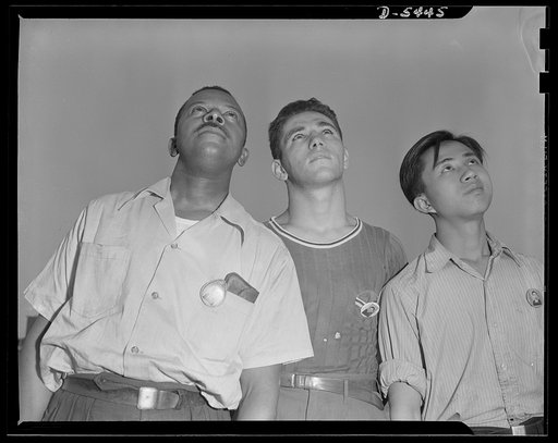 Americans all. "She's a beautiful ship," and it took the combined efforts of these three Americans to help build her. Marcell Webb, Negro; Henry Bennett; and Phillip Leung, Chinese, watch the test flight of a P-47 pursuit ship they helped build. Republic Aircraft Corporation