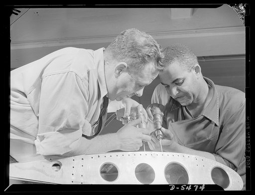 Training. Brooklyn Aviation Center. At the Brooklyn Aviation Trade Center, a student mechanic and an instructor work side by side using identical tools and performing identical operations on wing sections. The same method is employed in training beginners to work on other jobs in plane construction