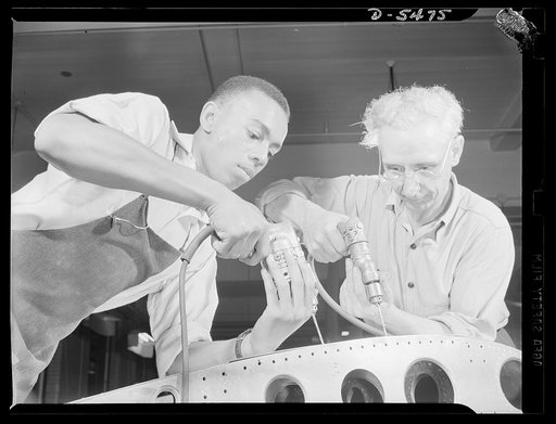 Training. Brooklyn Aviation Center. At the Brooklyn Aviation Trade Center, a student mechanic and an instructor work side by side using identical tools and performing identical operations on wing sections. The same method is employed in training beginners to work on other jobs in plane construction