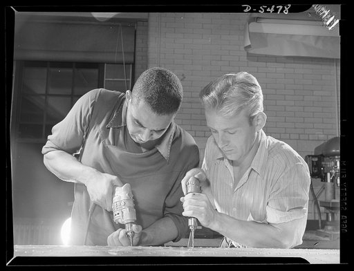 Training. Brooklyn Aviation Center. At the Brooklyn Aviation Trade Center, a student mechanic and an instructor work side by side using identical tools and performing identical operations on wing sections. The same method is employed in training beginners to work on other jobs in plane construction