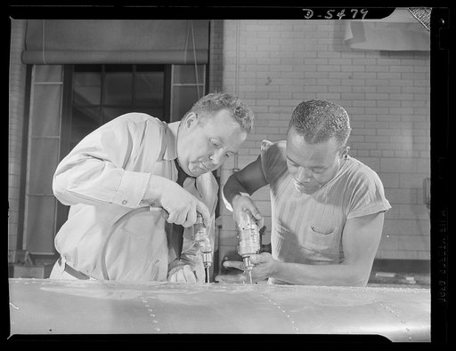 Training. Brooklyn Aviation Center. At the Brooklyn Aviation Trade Center, a student mechanic and an instructor work side by side using identical tools and performing identical operations on wing sections. The same method is employed in training beginners to work on other jobs in plane construction