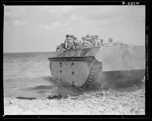 New River, North Carolina. Marine amphibian tractors. "Down to the sea" in an amphibian tractor. A special Marine unit, in training with its new land-and-water troop carrier at New River, North Carolina, has accomplished its mission of establishing a beachhead and is now on its way back to its ship