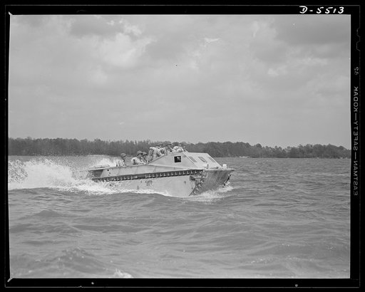 New River, North Carolina. Marine amphibian tractor. The soldiers of the sea have a new troop carrier that serves them well on land and in the water. A special Marine unit, training with an amphibian tractor at New River, North Carolina, is on its way from a battleship to establish a beachhead