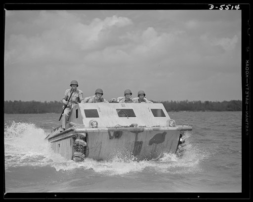 New River, North Carolina. Marine amphibian tractor. The soldiers of the sea have a new troop carrier that serves them well on land and in the water. A special Marine unit, training with an amphibian tractor at New River, North Carolina, is on its way from a battleship to establish a beachhead