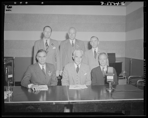 Standing, left to right: the Honorable William A.M. Burden, Special Aviation Assistant to the Secretary of Commerce; Willard E. Givens, Executive Secretary, National Education Association; John W. Studebaker, U.S. Commissioner of Education. Seated, left to right: the Honorable Ralph A. Bard, Assista