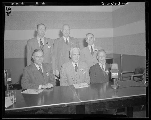 Standing, left to right: the Honorable William A.M. Burden, Special Aviation Assistant to the Secretary of Commerce; Willard E. Givens, Executive Secretary, National Education Association; John W. Studebaker, U.S. Commissioner of Education. Seated, left to right: the Honorable Ralph A. Bard, Assista