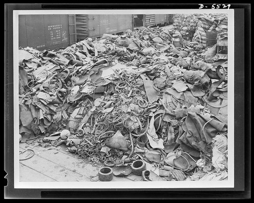 Salvage. Scrap rubber collection. Have you any old rubber lying around? Look at this picture closely and you will find many things that you too can contribute to the national scrap rubber pile. This accumulation in the yards of the Dowenthal Company in Akron, Ohio, contains old bicycle tires, hot wa