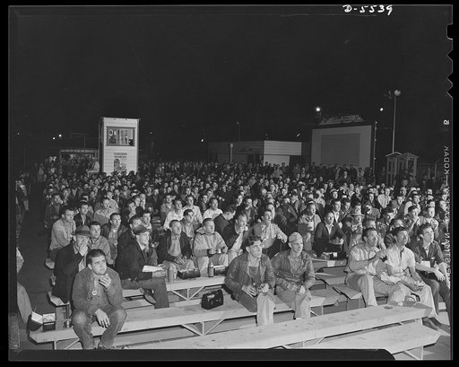 Production. Airplanes. Lunch with Popeye. While the swing shift of a large Western aircraft plant munch sandwiches in one of the recreation areas provided by the company, they watch Popeye eat his spinach before giving battle in a screen cartoon
