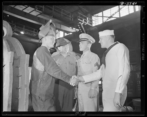 A poster comes to life. "I've been waitin' for this moment," said George Woolslayer, as he shook hands with his poster-model colleagues, Sergeant Vineyard and Chief Evans, "and I'm mighty proud." Although Woolslayer was somewhat more voluble than his service friends, all of the men admitted to being