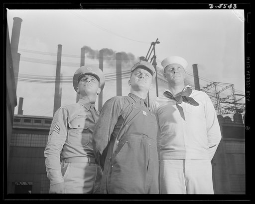A poster comes to life. The very life of each of these men depends upon the other. Soldier, steel worker, sailor, their destinies are interdependent in America's all-out war against the Axis. Sergeant French L. Vineyard, welder George Woolslayer and Aviation-radio Chief John Marshall Evans stand aga
