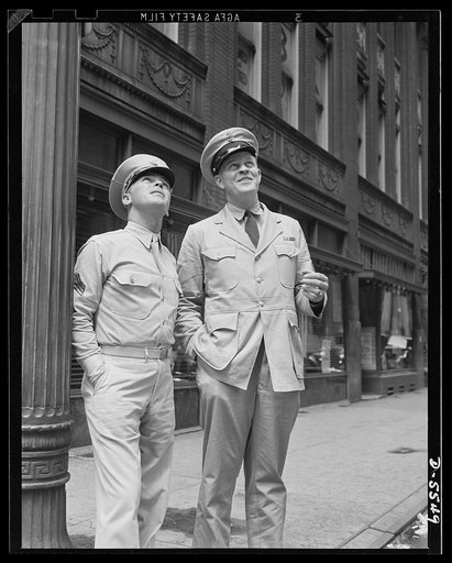 A poster comes to life. Maybe it's a skyscraper, maybe it's the statue of a city father, or it could be a pretty face in a window that Sergeant Vineyard and Chief Evans are viewing with much approval on their sight-seeing jaunt around the city Sunday morning