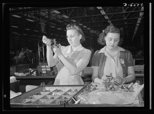 Production. Aircraft engines. Hundreds of gears pass through the expert hands of Dorothy Miller and Sylvia Dreiser during their eight-hour working day in a large Midwest aircraft plant. Inspection of these vital cogs in America's war machine is a delicate task and one which requires infinite patienc