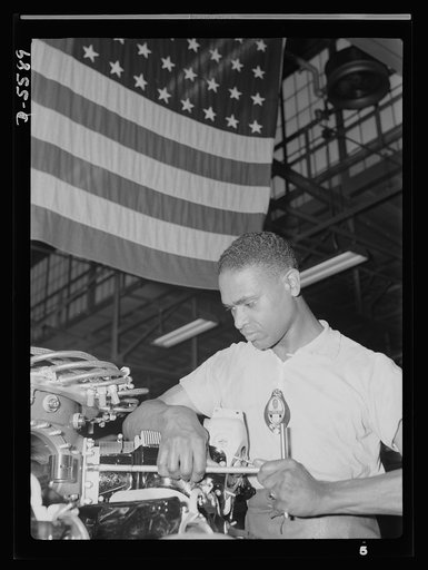 Production. Aircraft engines. A skilled mechanic and determined war worker, Zed W. Robinson, proves that skin pigment bears no relation to efficiency of work. He's one of many Negroes employed in a large Midwest aircraft plant in skilled and semi-skilled capacity. Tightening bolts of a cylinder barr