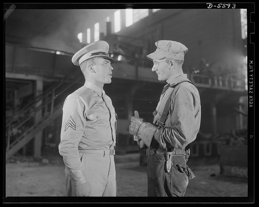 A poster comes to life. Two soldiers learn about each other's contribution to the war effort in the shadow of one of the nation's roaring steel furnaces. Sergeant French Vinyard tells this Allegheny-Ludlum electrician about life in the Army and learns in turn what it takes to turn out the weapons of