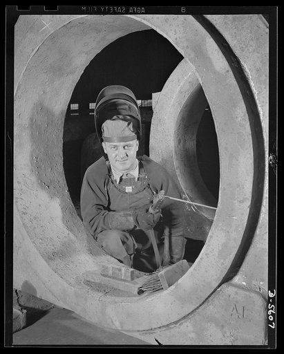 A poster comes to life. Meet an American soldier of Production. George Woolslayer, thirty-two-years-old, is an experienced welder at one of Allegheny-Ludlum's steel mills. His uniform is a pair of overalls and a welder's mask. Not reveille but a battered alarm clock awakens him six days a week at 6 