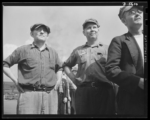 A poster comes to life. The roar of blast furnaces and the whistles of mill yard trains beat a rhythmic accompaniment to the words of Sergeant Vineyard and Chief Evans who spoke to a group of steelworkers at one of Allegheny-Ludlum's plants. At this informal gathering in the mill yard, the serviceme
