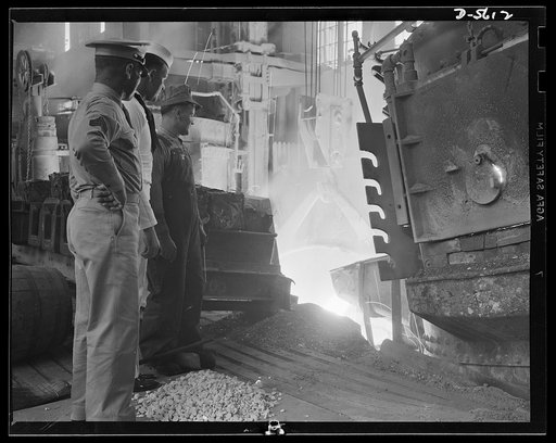 A poster comes to life. Like liquid fire, molten steel is poured from an electric furnace into a ladle. When drawn, forged, treated and cast, this red river will be a tank, a ship's hull, or a hundred guns for men like Sergeant Vineyard and Chief Evans to use against the enemy. George Woolslayer, we