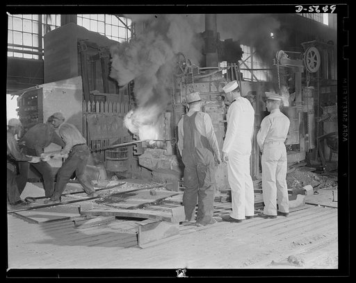 A poster comes to life. The three men watch the beginning of a tapping operation on a small (thirty-five ton) electric furnace. Allegheny-Steel, Pittsburgh, Pennsylvania