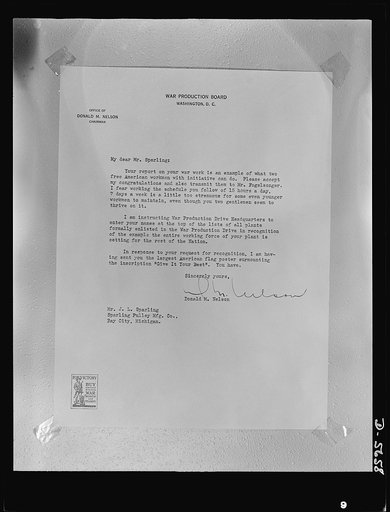 "Me and the old gent." A citation by Donald Nelson, commending the war production effort of Jake Sparling, sixty, and Percy Fogelsong, seventy-nine-year-old ex-lumberjack, who between them produced 18,000 steel flanges for war equipment in eighteen months. "The old gent and me" have been working fif