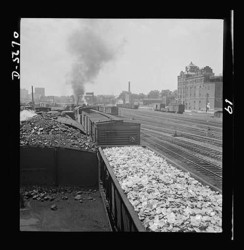 Tin can alley leads to victory. Used tin cans, which in normal times would be discarded and forgotten, are transported to a de-tinning plant where they will undergo reclaiming processes. Much of the tin reclaimed from these cans will be used on more cans containing foodstuffs for American soldiers a