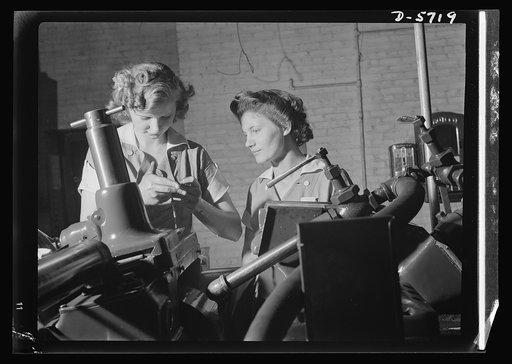 Women in industry. Tool  production. Pioneers of the production line, these two young workers are among the first women ever to operate a centerless grinder, a machine requiring both the knowledge of precision measuring instruments, and considerable experience and skill in setting up. In this Midwes