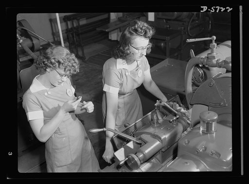 Women in industry. Tool  production. Two to a machine, these young employees of a Midwest drill and tool company are operating cylindrical grinders. This work is delicate and difficult, for the drills must be tapered accurately to size. The drills will be used in manufacture of guns, ships, tanks an
