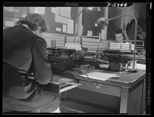 Office equipment used by the War Production Board (WPA). Operators using vari-typers for making mimeograph stencils for the WPB's duplicating department. The W PB has six of these machines