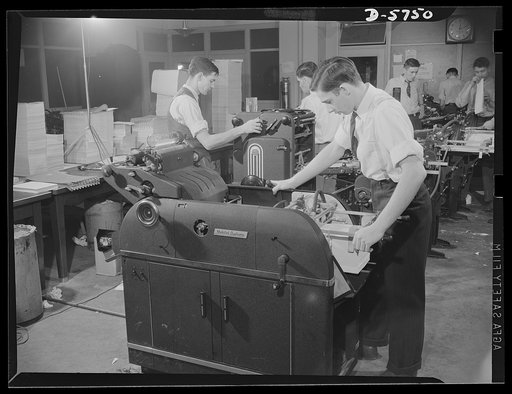 Office equipment used by the War Production Board (WPB). Offset duplicating room in the WPB's duplicating and printing section. All the machines, save one, are multiliths; one is a Davidson duplicator. Every machine is in operation twenty-four hours a day and turns out 5,000 prints an hour