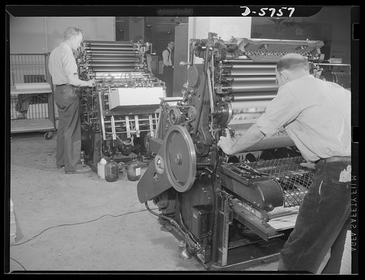Office equipment used by the War Production Board (WPB). These Webendorger automatic offset presses are the largest of the types of offset presses in the WPB's duplicating department. These machines are in operation twenty-four hours a day and turn out 5,000 prints an hour
