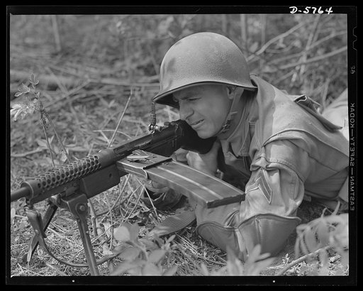 New River, North Carolina. Marine Corps submachine gunners. One of the newest and deadliest weapons of the Marine Corps, a Johnson submachine gun, is operated by a man who knows what to do with it. This leatherneck, in training at New River, North Carolina, is making himself proficient with a weapon