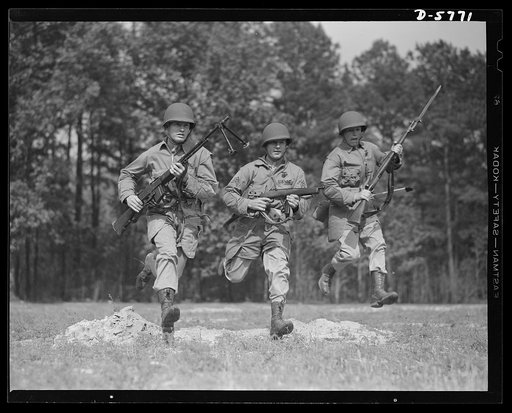 New River, North Carolina. Marine infantry. "We have fought in every land and clime where we could bring a gun." The major infantry weapons these charging Marines carry at New River, North Carolina maneuvers are: left, Browning automatic rifle; center, Reising submachine gun; right, .30 caliber rifl