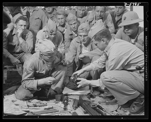 New River, North Carolina. Marine truck transport units. Marine Corps transport workers study the assembly of one of the many weapons the leathernecks use in war exercises at New River, North Carolina. Marine barracks, New River, North Carolina