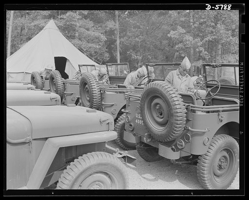 New River, North Carolina. Marine truck transport units. The Marine Corps throws a lot of jobs to the jeeps. Here are some of the hard-boiled little cars lined up for servicing in the battalion garage at the New River, North Carolina base. Marine barracks, New River, North Carolina