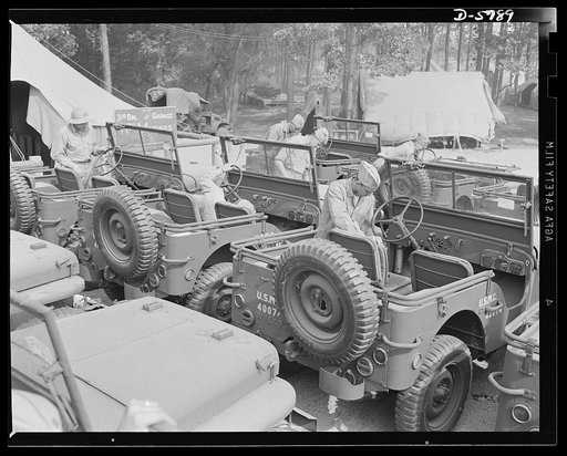 New River, North Carolina. Marine truck transport units. The Marine Corps throws a lot of jobs to the jeeps. Here are some of the hard-boiled little cars lined up for servicing in the battalion garage at the New River, North Carolina base. Marine barracks, New River, North Carolina