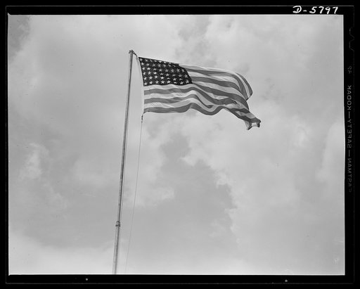 New River, North Carolina. Marines in training. "Our flag's unfurled to every breeze." Old Glory floats proudly over the Marine base at New River, North Carolina, where the leathernecks are staging dress rehearsals of the big show they will soon be putting on all over the world. Marine barracks, New