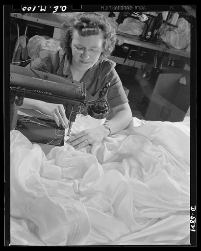 Production. Parachute making. Every stitch on this basting machine means as much to Eva Matties as the parachutes she is sewing may mean to her fiance in the Army. Miss Matties also has two brothers in the service, one stationed at an air base, the other in an aircraft carrier somewhere in the Pacif