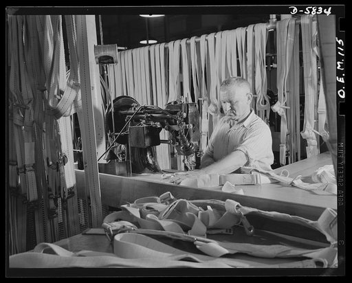 Production. Parachute making. German-born Reinhard Lehman left his family in charge of his farm so that he could make these parachute harnesses in an Eastern plant. One of his sons is in the Marines, a nephew is in the Army. Pioneer Parachute Company, Manchester, Connecticut