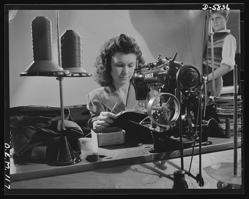 Production. Parachute making. Doing her part, as her brother in the Navy is doing his, this operator is assembling packs for parachutes in an Eastern plant. Pioneer Parachute Company, Manchester, Connecticut