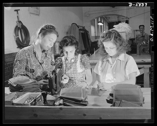 Production. Parachute making. First-generation Americans whose parents represent Italy, Greece, and England, these three girls work side by side at the punching machine in an Eastern parachute factory. Pioneer Parachute Company, Manchester, Connecticut