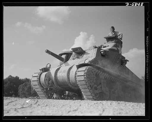 Fort Knox, Kentucky. M-3 tanks. The M-3 tank packs a wallop which the Axis is only beginning to feel. One of these capable monsters, with a tough American crew aboard, is put through its paces in the training area near Fort Knox, Kentucky