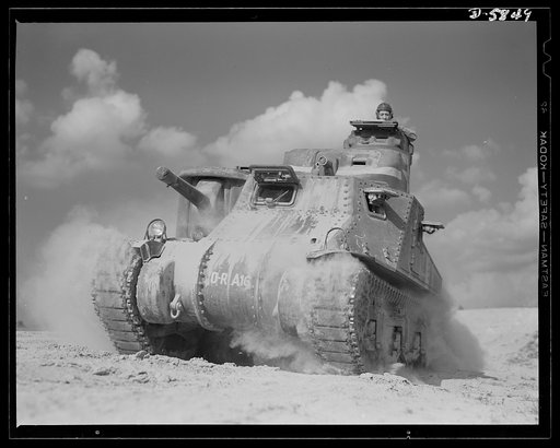 Fort Knox, Kentucky. M-3 tanks. The M-3 tank packs a wallop which the Axis is only beginning to feel. One of these capable monsters, with a tough American crew aboard, is put through its paces in the training area near Fort Knox, Kentucky