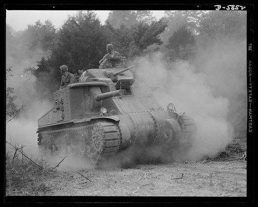 Fort Knox, Kentucky. M-3 tanks. The M-3 tank packs a wallop which the Axis is only beginning to feel. One of these capable monsters, with a tough American crew aboard, is put through its paces in the training area near Fort Knox, Kentucky