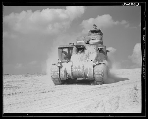 Fort Knox, Kentucky. M-3 tanks. The M-3 tank packs a wallop which the Axis is only beginning to feel. One of these capable monsters, with a tough American crew aboard, is put through its paces in the training area near Fort Knox, Kentucky