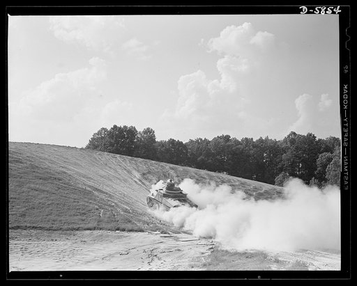 Fort Knox, Kentucky. M-3 tanks. The M-3 tank packs a wallop which the Axis is only beginning to feel. One of these capable monsters, with a tough American crew aboard, is put through its paces in the training area near Fort Knox, Kentucky