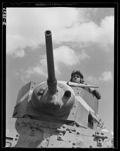 Fort Knox, Kentucky. Light tanks. The Axis is not going to like the American fighting men it will soon be meeting on the battlefronts of the world. Good example of a man becoming unpopular in Japanese circles is this hardened "tanker," in training with light equipment at Fort Knox, Kentucky