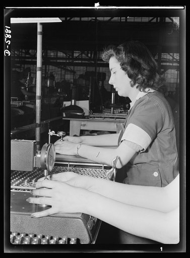 Women in industry. Aircraft motor workers. Scarlet fingernails give emphasis to the important work that feminine fingers are doing on this inspection line. Performing a delicate and repetitive job, women at this Midwest aircraft motor plant use dial indicator gauges in the process of inspection of b