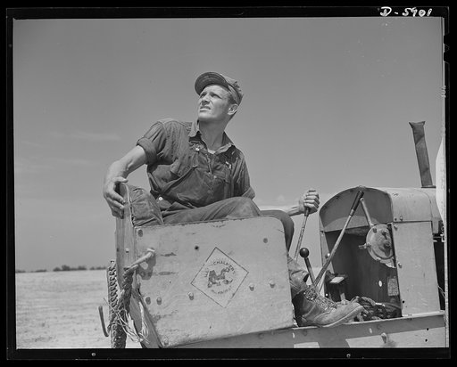 Fort Knox. Electric power line construction. This tractor operator, working with a pole line construction crew, is helping to bring electrical power to Fort Knox, Kentucky, where American soldiers are rehearsing for the dramatic parts they will play in the making of a new world
