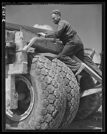 Fort Knox. Earth moving equipment. A huge carryall scraper, helping to build a new access road at Fort Knox, Kentucky, needs these enormous tires to support the great weight of machine and load under all conditions of travel