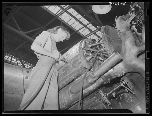 Women airport workers. Acutely aware of our country's need for more womanpower in airplane plants and airports, Mrs. Majorie Landa has enlisted as a member of the repair crew of the Washington National Airport. Daughter of the late Congressman Frank Mandell of Wyoming, Mrs. Landa is shown making rep