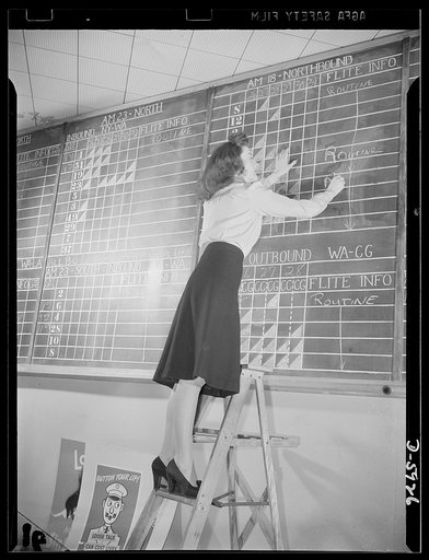 Women aircraft workers. Perched high on a ladder behind the ticket counter at the Washington National Airport, twenty-two-year-old Kay Dowd makes entries on the flight information board. Graduate of an Eastern college, Kay served her airport apprenticeship at New York's La Guardia Airfield. As Super